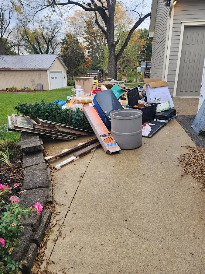 Dumpster being loaded with debris for Commercial Dumpster Rental in Rainbow City